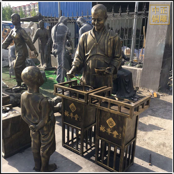 現(xiàn)代步行街飯店門口人物銅雕塑.jpg